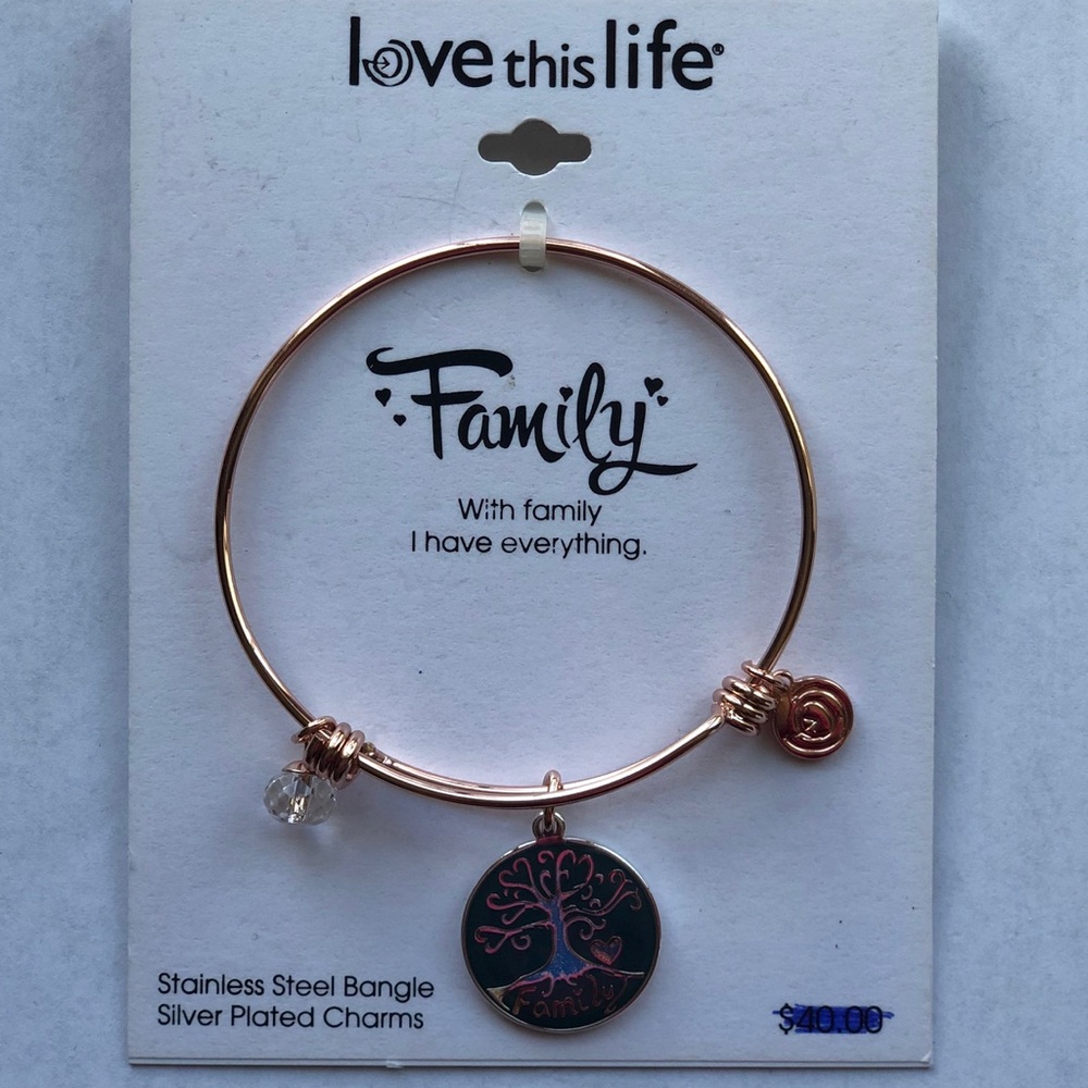 Gold bangle with family charm